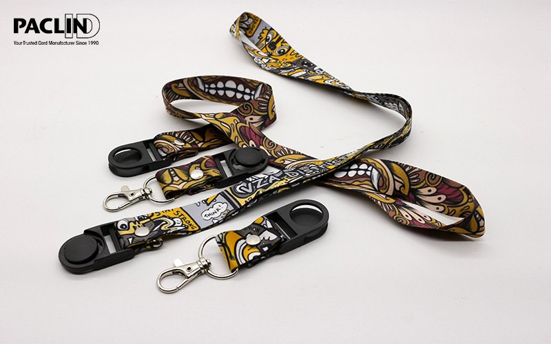 Patterned PACLIN ID lanyards with black clips and metal clasps on a white background